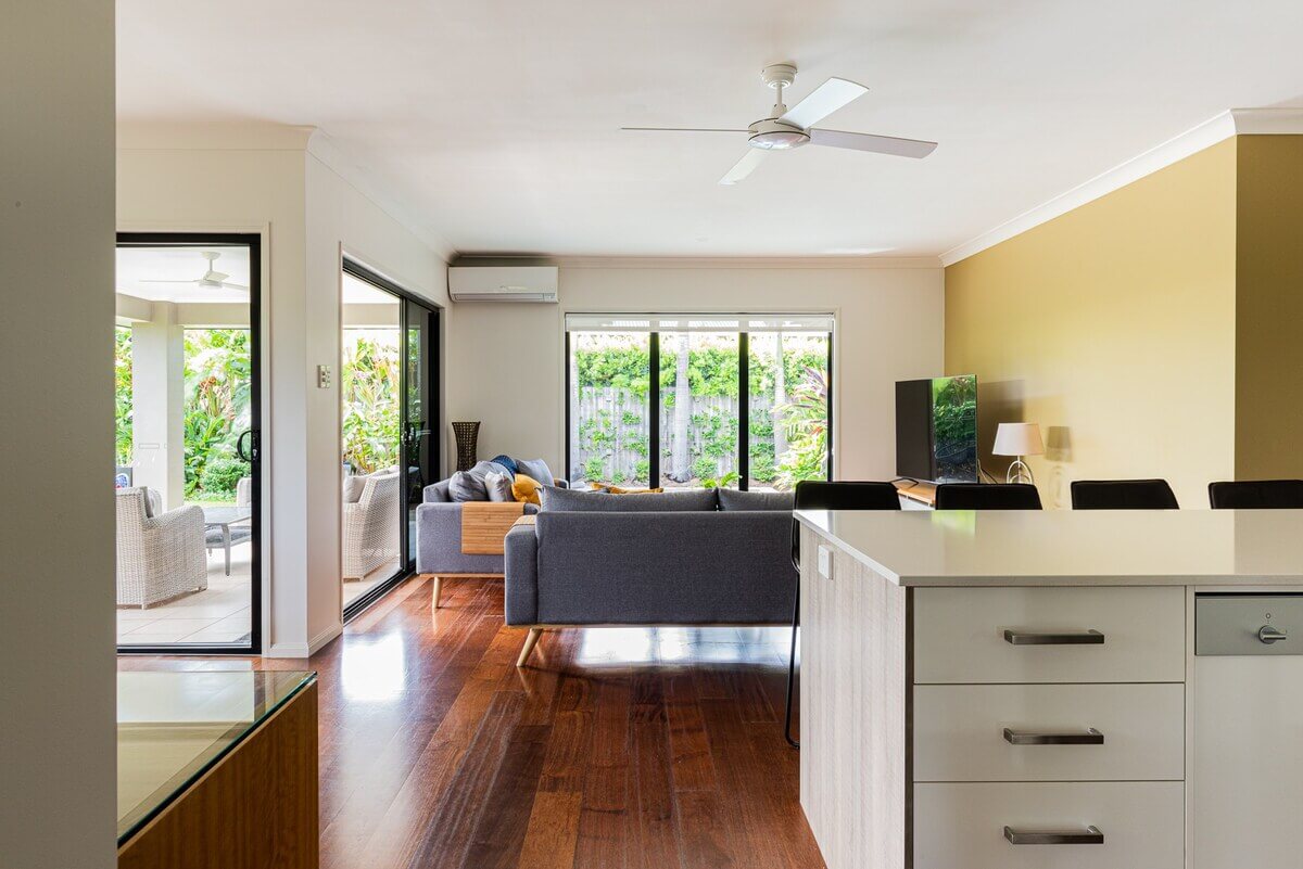 Entering the open-plan kitchen, dining, and family room